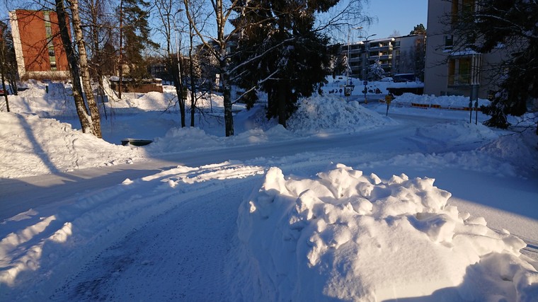 Photo of a driveway in sunny, snowy weather
